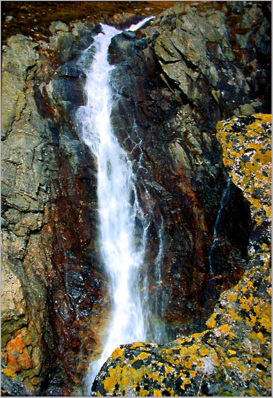 waterfall on granite, the alps